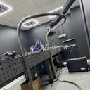 Workshop area with tools and equipment on a metal workbench.