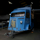 Blue SWB Trailer with 'Rosa Blanca' branding in a warehouse setting