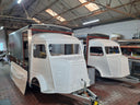 Two Short Wheelbase (SWB) trailers inside the GHST KTCHN workshop. 